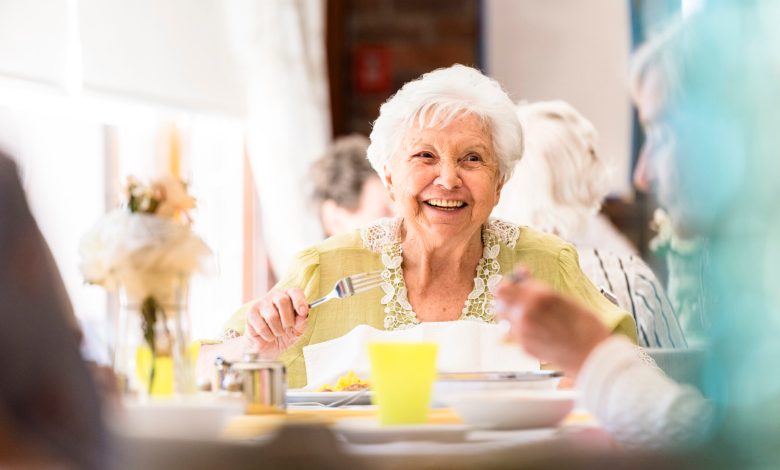 Portrait photo of a senior woman having lunch