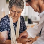 A doctor in a nursing home with a patient