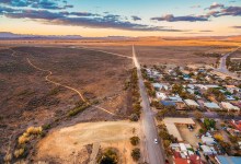 Rural road passing through Hawker - town in South Australia at sunset