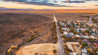 Rural road passing through Hawker - town in South Australia at sunset