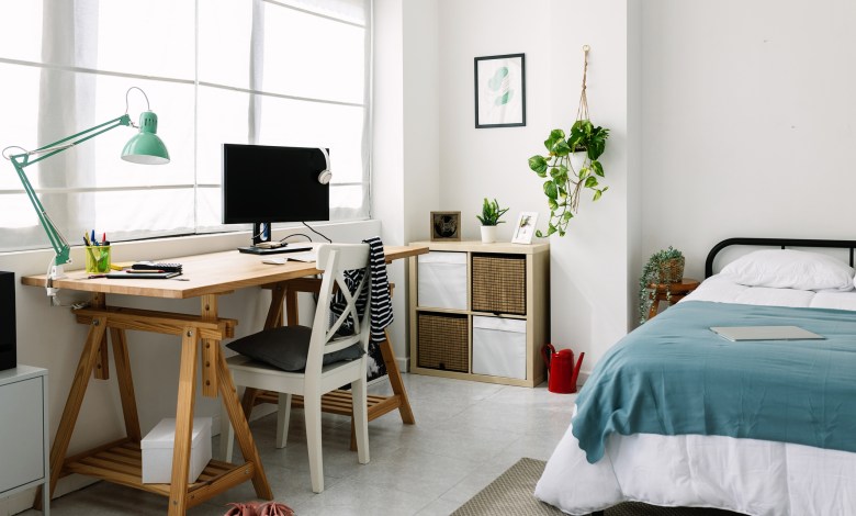 Cozy interior teenage person room with bed and desk