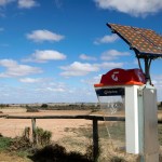 "South Australia, Australia - 12th, May 2012 : Australian Telstra public phone in the outback town of Olary with a solar panel, some areas of Australia mobile phones have no signal."